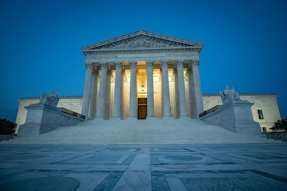 US Supreme Court building at night