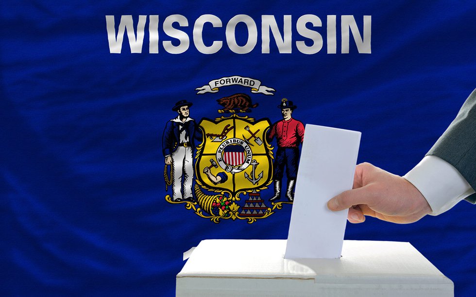 Voting in ballot box with Wisconsin flag