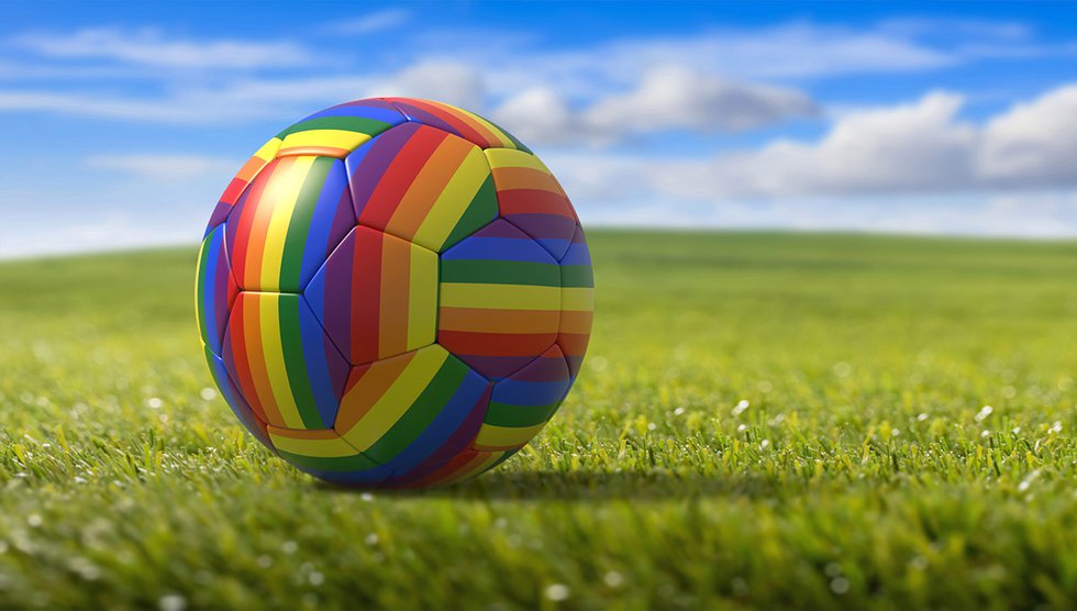 Rainbow soccer ball on field