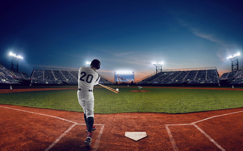 Baseball batter at night in stadium