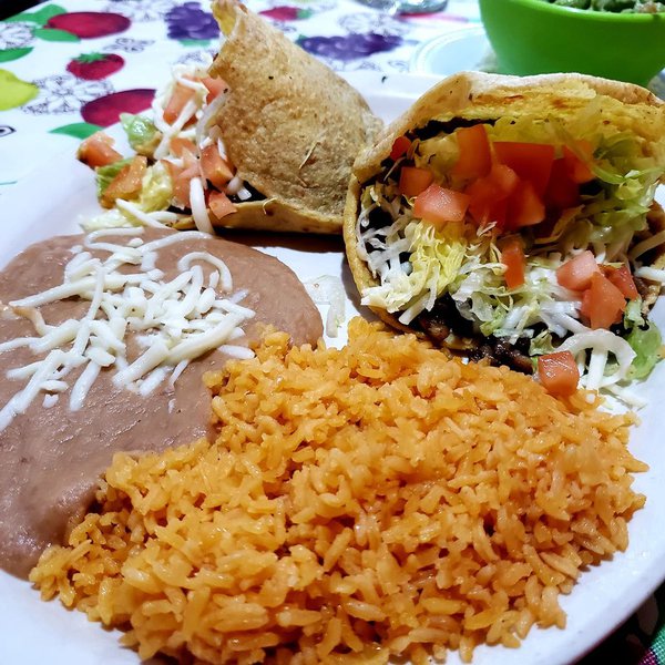 El Tucanazo tacos, beans and rice