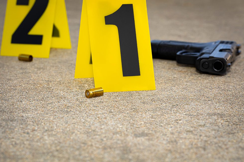 Shooting scene with gun and casings