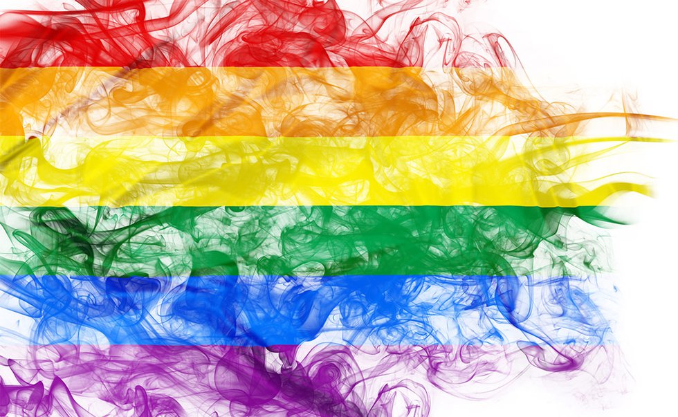 Rainbow flag over smoke