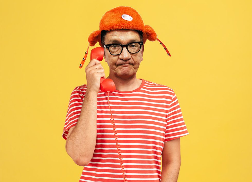 Art Kumbalek on phone in striped shirt