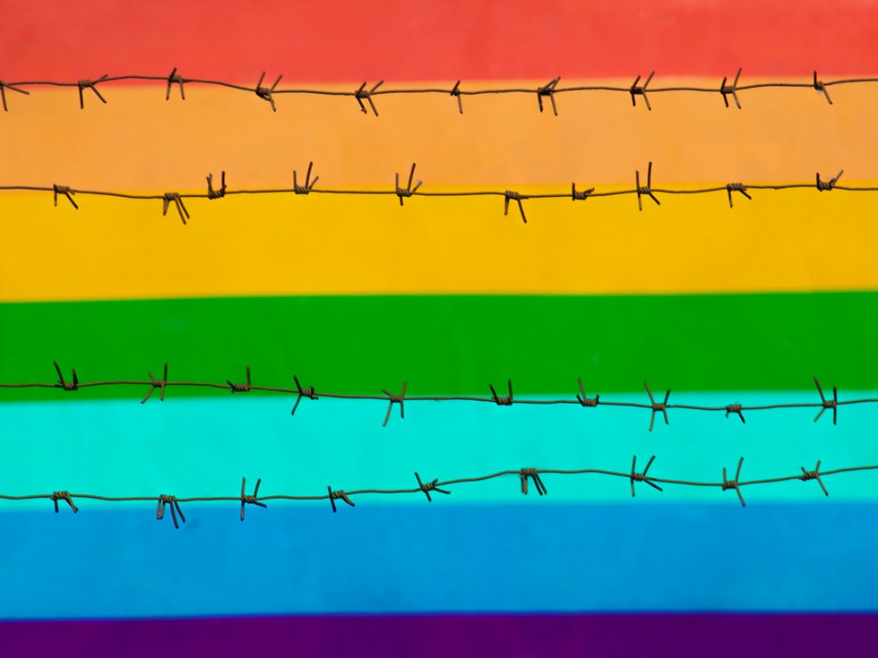 Barbed wire over pride flag