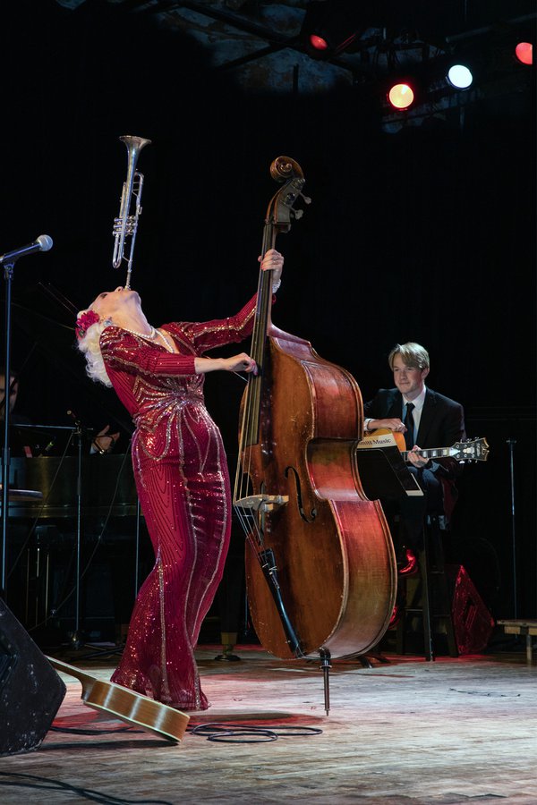 Gunhild Carling playing the horn and bass