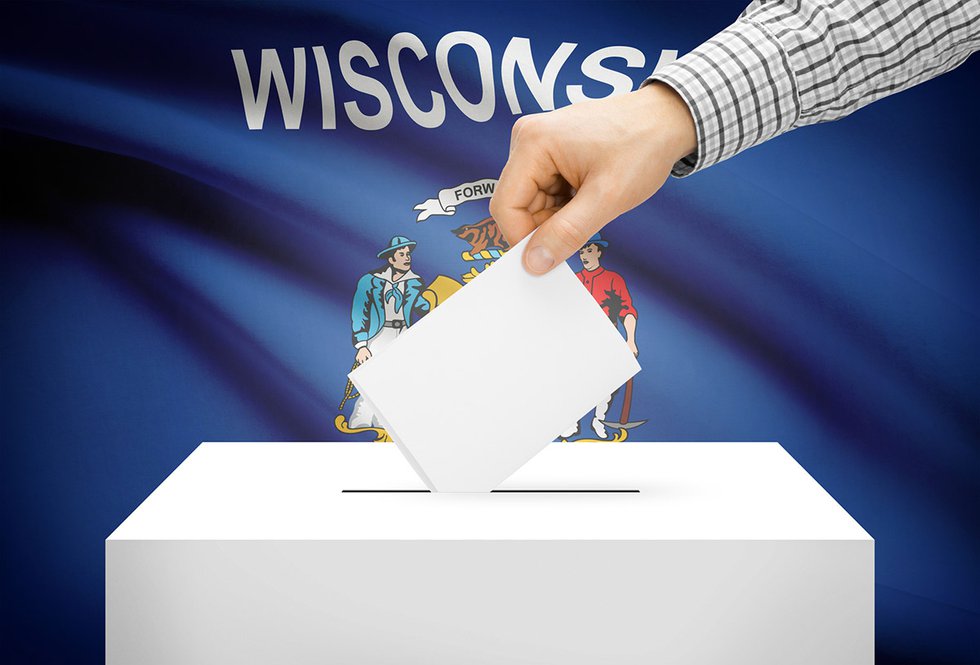 Ballot casting with Wisconsin flag
