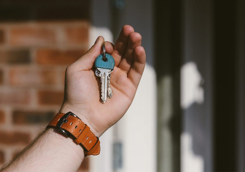 Holding keys at front door