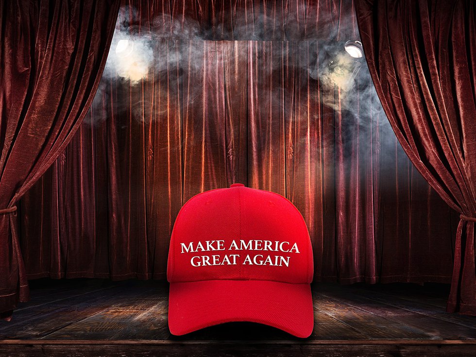 MAGA hat on stage