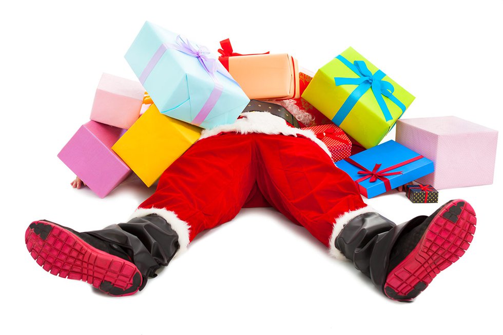 Santa under pile of presents