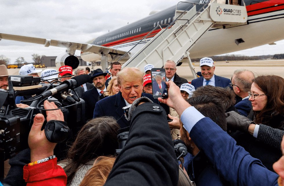 Donald Trump with news reporters