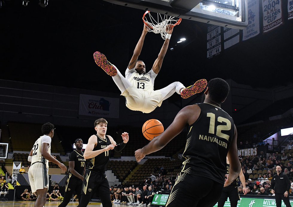 The Panthers' Langston Wilson dunking over the Oakland competition.