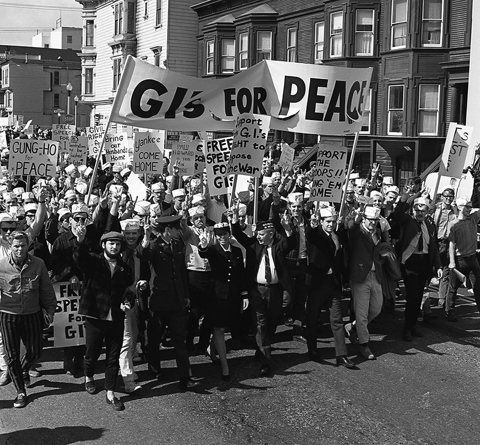 Lt. Susan Schnall leads soldiers and sailors in a peace march in October 1968