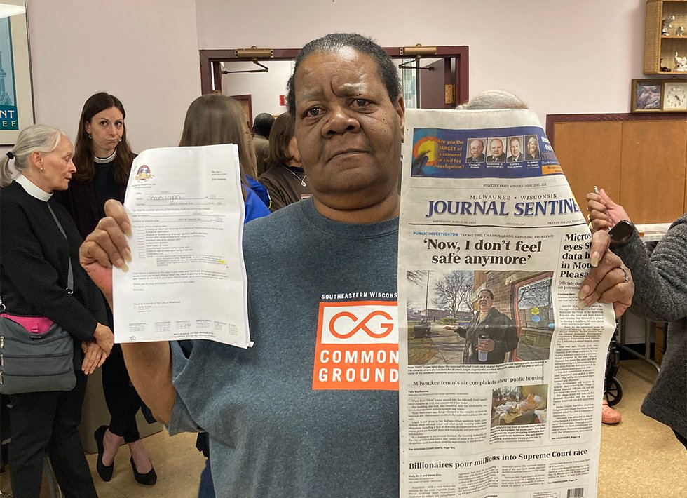 Chris Logan holding Milwaukee Journal-Sentinel story