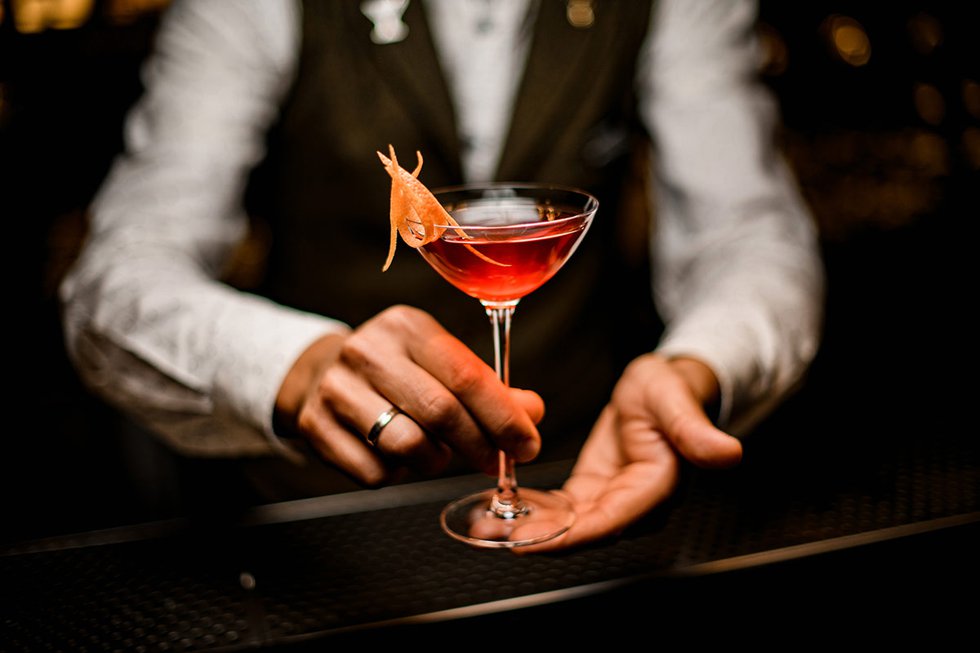 Bartender serving cocktail