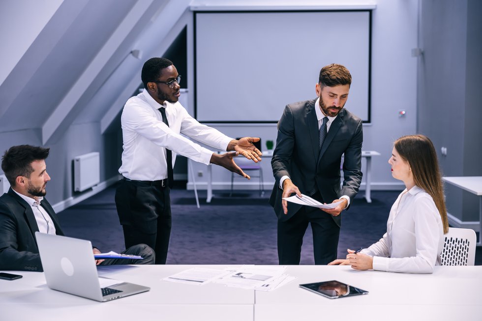 Colleagues Argue at Corporate Meeting