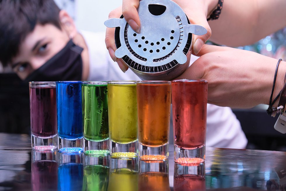 Rainbow drinks being poured